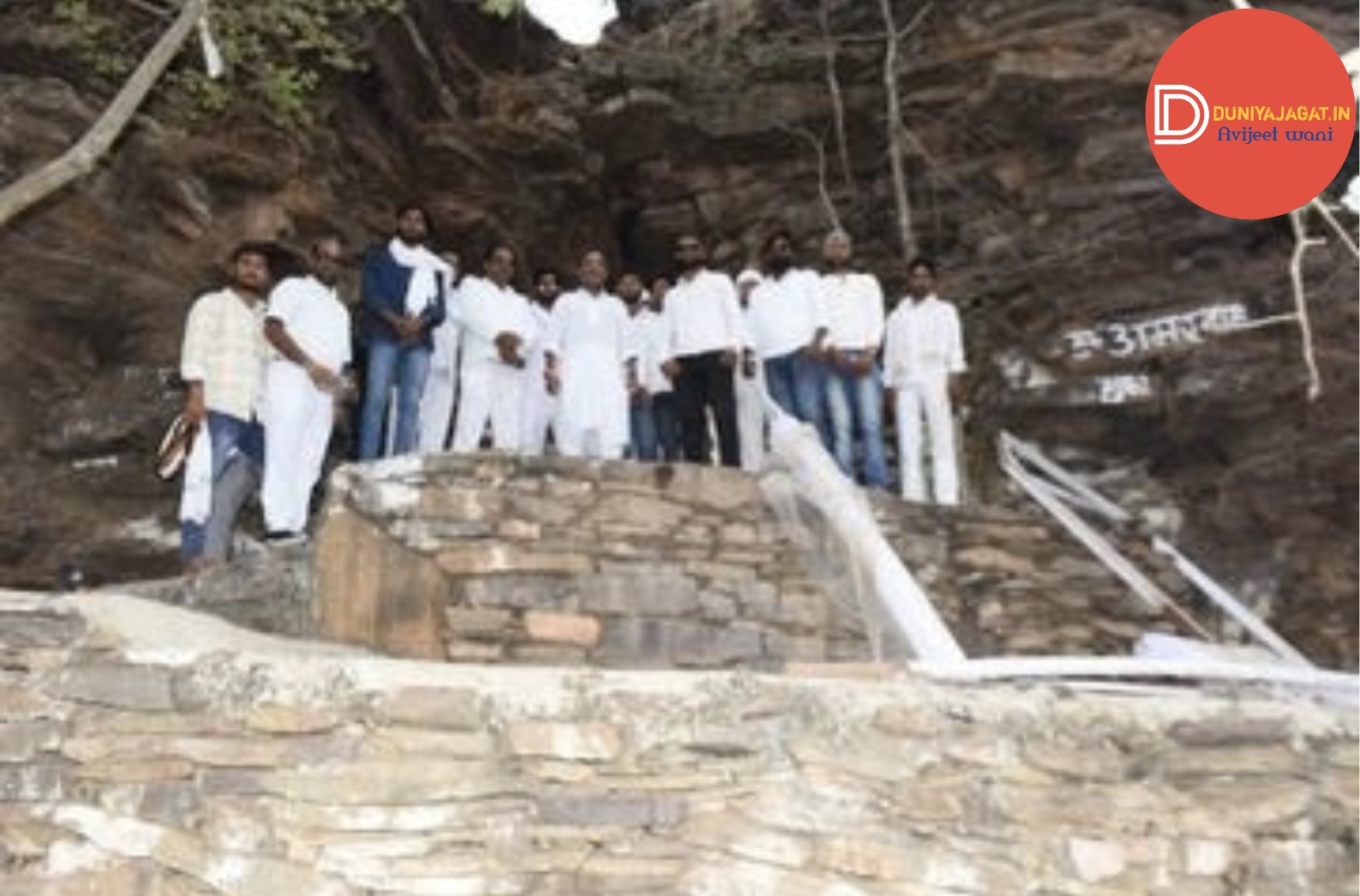 a group of men standing on a stone staircase